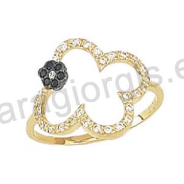 Μοντέρνο εντυπωσιακό δαχτυλίδι Κ14 χρυσό με λουλούδι με άσπρες και μαύρες πέτρες ζιργκόν και μαύρο πλατίνωμα