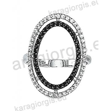Μοντέρνο λευκόχρυσο δαχτυλίδι Κ14 με άσπρες και μάυρες πέτρες ζιργκόν σε σχήμα κύκλου και μαύρο πλατίνωμα
