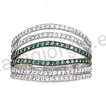 Μοντέρνο δαχτυλίδι λευκόχρυσο Κ14 με άσπρες και γαλάζιες πέτρες ζιργκόν και μαύρο πλατίνωμα