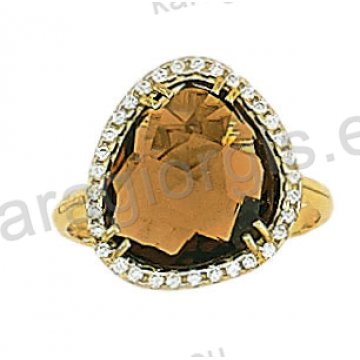 Μοντέρνο δαχτυλίδι χρυσό Κ14 με μία κεντρική πέτρα ζιργκόν σε χρώμα citrin και άσπρες πέτρες ζιργκόν