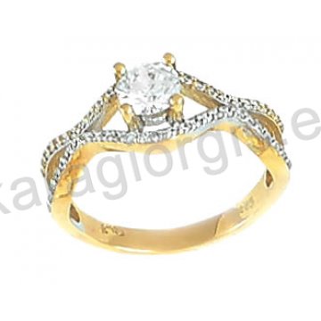Μονόπετρο δίχρωμο δαχτυλίδι Κ14 λευκόχρυσο με χρυσό σε χιαστί με πέτρες ζιργκόν.