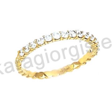 Ολόβερο δαχτυλίδι Κ14 χρυσό με πέτρες ζιργκόν.