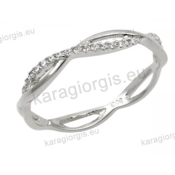 Δαχτυλίδι γυναικείο λευκόχρυσο Κ14 σε χιαστί με άσπρες πέτρες ζιργκόν.