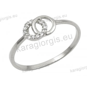 Δαχτυλίδι γυναικείο λευκόχρυσο Κ14 με κύκλους με άσπρες πέτρες ζιργκόν.