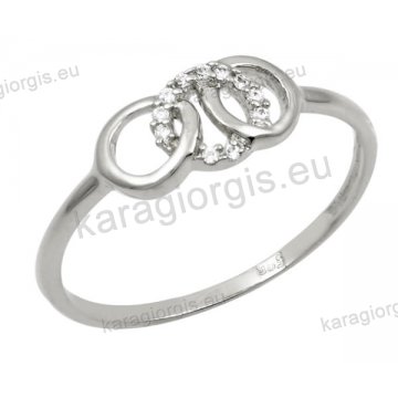 Δαχτυλίδι γυναικείο λευκόχρυσο Κ14 με κύκλους με άσπρες πέτρες ζιργκόν.