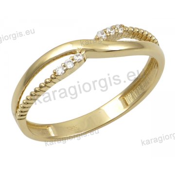 Δαχτυλίδι γυναικείο χρυσό Κ14 σε χιαστί με άσπρες πέτρες ζιργκόν.